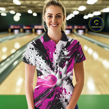 Load image into Gallery viewer, Woman wearing a pink splatter bowling polo shirt at a bowling alley front view.