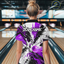 Load image into Gallery viewer, Back view of woman wearing a purple splatter bowling polo shirt inside a bowling alley.