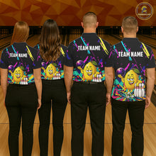 Load image into Gallery viewer, Back view of bowling team wearing matching lemon bowling shirts in a bowling alley.