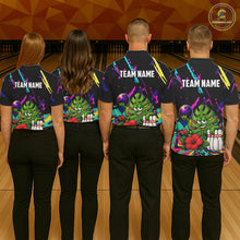 Load image into Gallery viewer, Back view of bowling team wearing matching tropical bowling shirts in a bowling alley.
