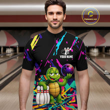 Load image into Gallery viewer, Man wearing a colorful bowling shirt with a turtle graphic in a bowling alley.