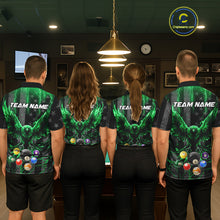 Load image into Gallery viewer, Back view of pool players wearing matching green lightning billiard shirts in a game room.