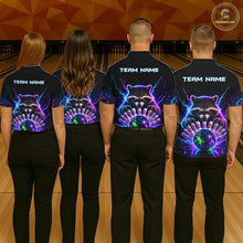 Load image into Gallery viewer, Back view of bowling team wearing matching neon raccoon bowling shirts in a bowling alley.
